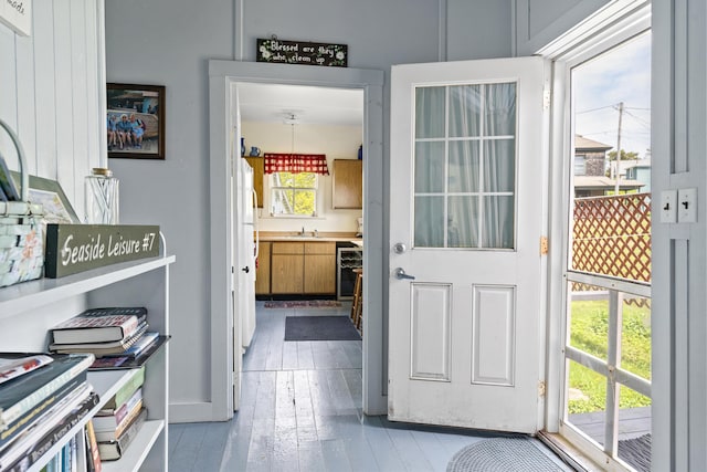 10 S Colony Branch Rd, Harpswell, ME 04079 - doorway featuring a sink and wood finished floors