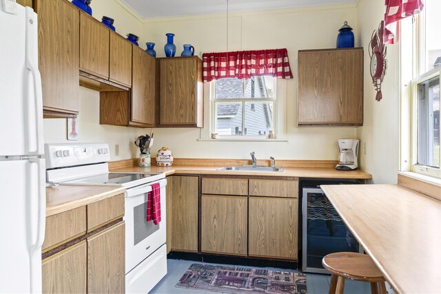 10 S Colony Branch Rd, Harpswell, ME 04079 - kitchen with white appliances, a sink, wine cooler, light countertops, and under cabinet range hood