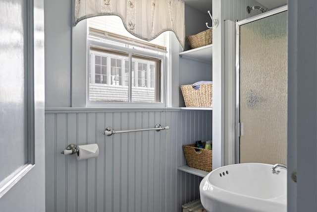 10 S Colony Branch Rd, Harpswell, ME 04079 - bathroom featuring wainscoting, a shower stall, and a sink