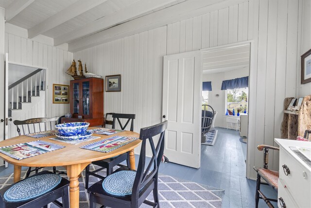 10 S Colony Branch Rd, Harpswell, ME 04079 - dining room with beam ceiling, wood finished floors, stairs, and wooden walls