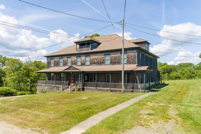 10 S Colony Branch Rd, Harpswell, ME 04079 - view of front of home with covered porch, a front lawn, and a balcony