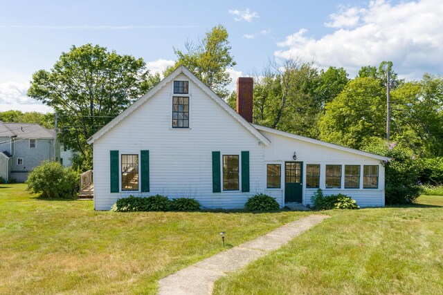 10 S Colony Branch Rd, Harpswell, ME 04079 - view of front of home with a chimney and a front lawn