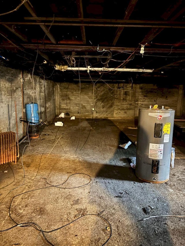 118 Athens Rd, Hartland, ME 04943 - unfinished basement featuring water heater and a water pressure tank