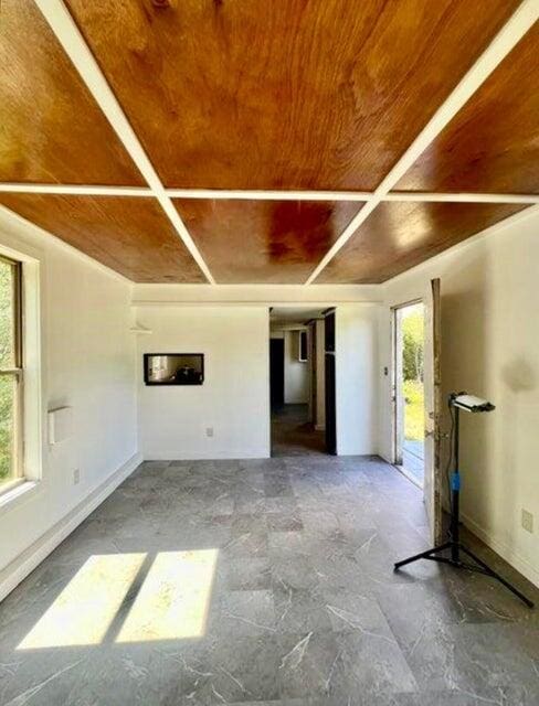 105 Arthur Allen Rd, Sumner, ME 04292 - spare room with wood ceiling and baseboards