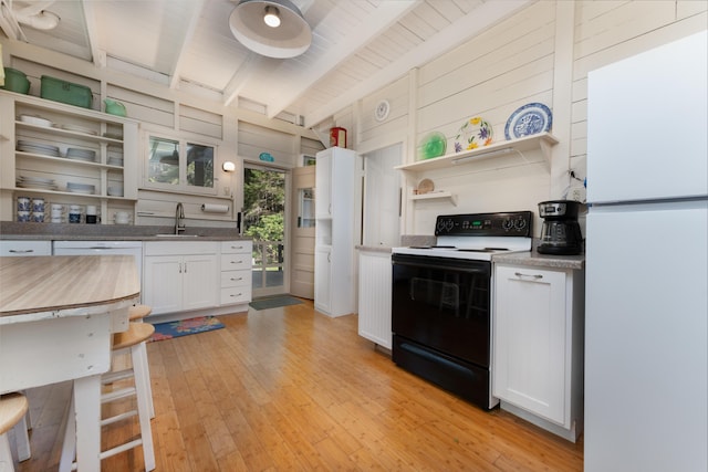 51 W Marginal Rd, Brunswick, ME 04011 - kitchen with range with electric stovetop, freestanding refrigerator, open shelves, beam ceiling, and light wood-style flooring