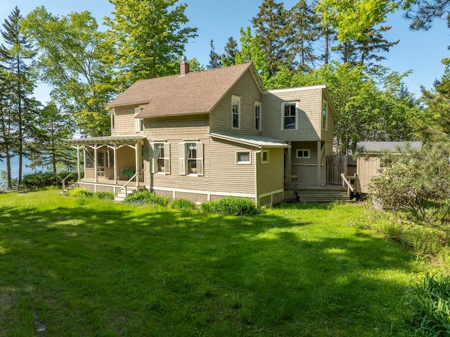 51 W Marginal Rd, Brunswick, ME 04011 - back of house with a yard, a chimney, covered porch, and roof with shingles
