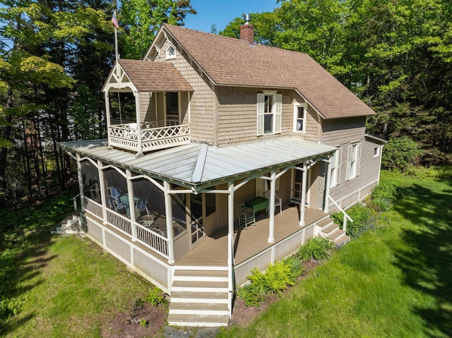51 W Marginal Rd, Brunswick, ME 04011 - rear view of property featuring a balcony, a chimney, a lawn, and a shingled roof
