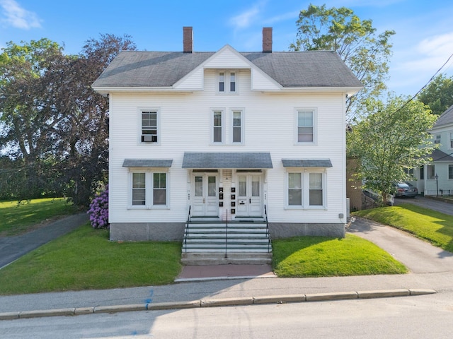 34 Birch St, Biddeford, ME 04005 - view of front of property with a front lawn, a chimney, and french doors