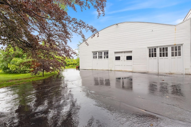 34 Birch St, Biddeford, ME 04005 - view of property exterior with a detached garage