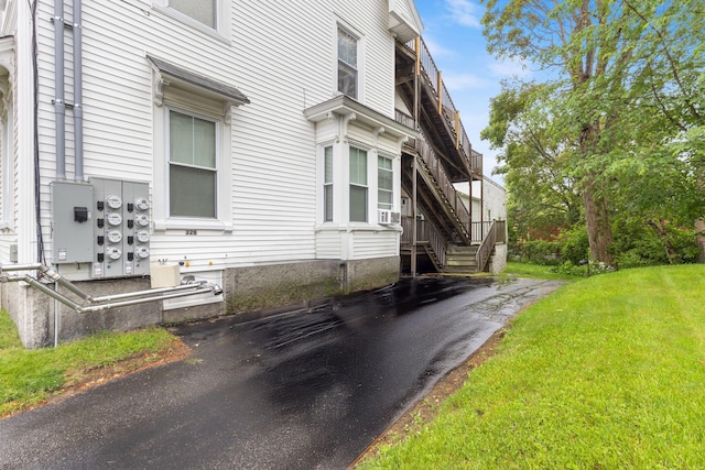 34 Birch St, Biddeford, ME 04005 - view of side of home with stairway and a yard