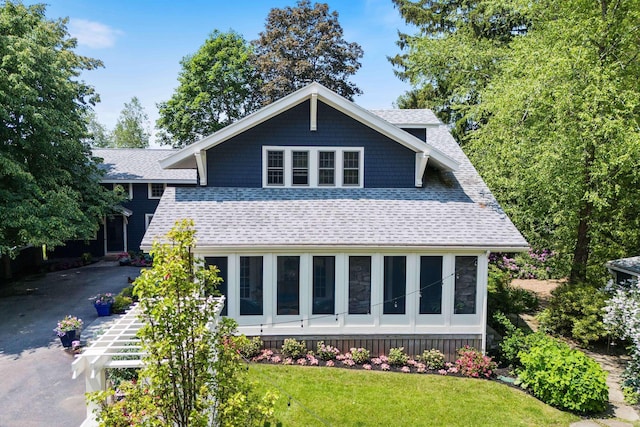 33 Rocky Ln, Ogunquit, ME 03907 - view of front of house with roof with shingles, a front yard, and asphalt driveway