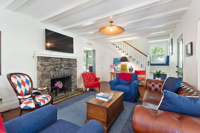 33 Rocky Ln, Ogunquit, ME 03907 - living area featuring stairway, wood finished floors, beam ceiling, and a stone fireplace