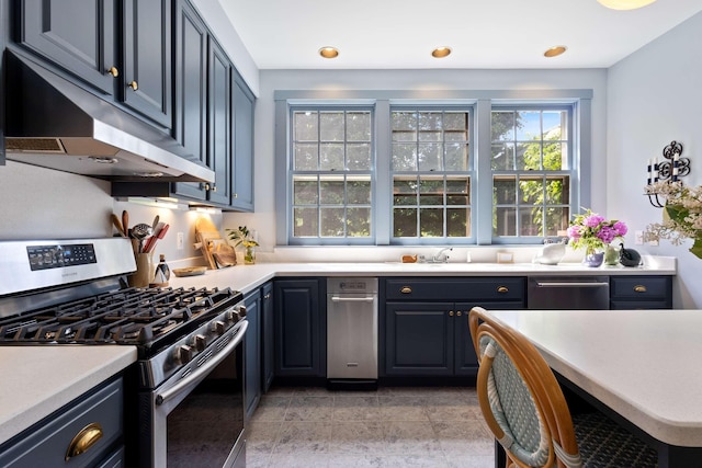33 Rocky Ln, Ogunquit, ME 03907 - kitchen featuring appliances with stainless steel finishes, under cabinet range hood, light countertops, and recessed lighting
