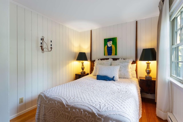 33 Rocky Ln, Ogunquit, ME 03907 - bedroom featuring a baseboard radiator, wood finished floors, and baseboard heating