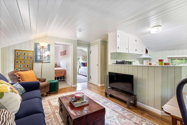 33 Rocky Ln, Ogunquit, ME 03907 - living room with lofted ceiling, light wood-type flooring, wood walls, and wood ceiling