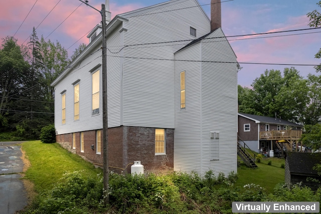 85 Friendship Rd, Waldoboro, ME 04572 - view of property exterior with brick siding, a yard, and a chimney