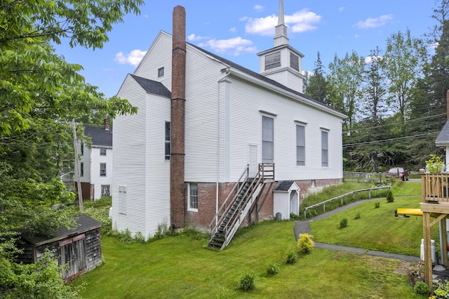 85 Friendship Rd, Waldoboro, ME 04572 - rear view of house featuring a yard, a chimney, and stairs