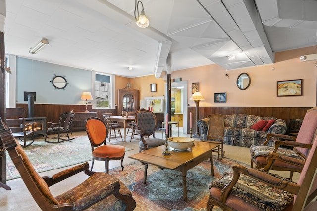 85 Friendship Rd, Waldoboro, ME 04572 - living area with wood walls, a wood stove, and a wainscoted wall