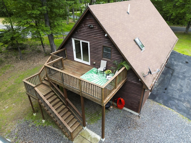 509 Upper Guinea Rd, Lebanon, ME 04027 - back of property featuring a wooden deck, stairway, and roof with shingles