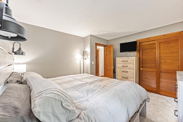 509 Upper Guinea Rd, Lebanon, ME 04027 - carpeted bedroom with a closet and a textured ceiling