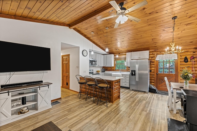 509 Upper Guinea Rd, Lebanon, ME 04027 - kitchen featuring appliances with stainless steel finishes, wood ceiling, light wood-style flooring, a chandelier, and a kitchen breakfast bar