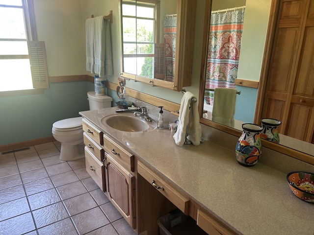 8 Camp Rd, Hartford, ME 04220 - full bathroom with toilet, vanity, tile patterned flooring, and baseboards