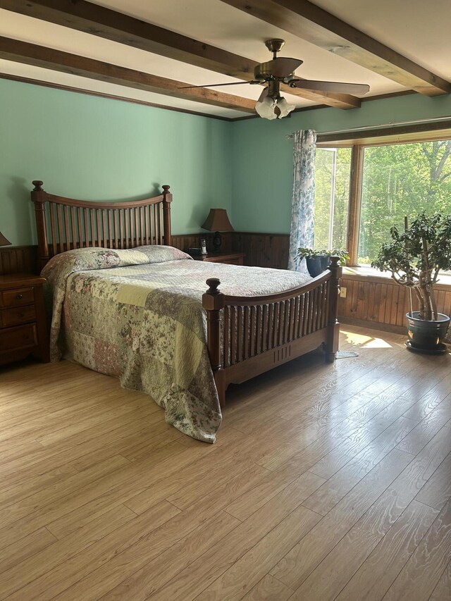 8 Camp Rd, Hartford, ME 04220 - bedroom featuring beam ceiling, a wainscoted wall, wood finished floors, and ceiling fan