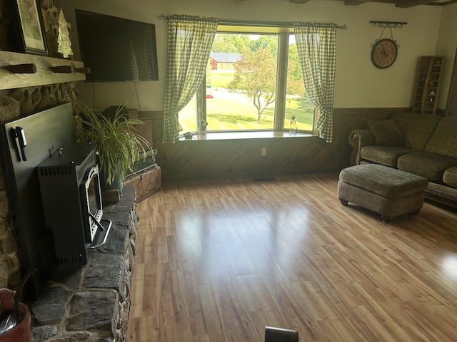 8 Camp Rd, Hartford, ME 04220 - living room with wainscoting, wood finished floors, and wood walls