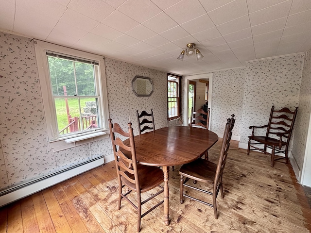 18 Kimball Rd, Bridgton, ME 04009 - dining room featuring wallpapered walls, a baseboard heating unit, light wood-style flooring, plenty of natural light, and baseboards