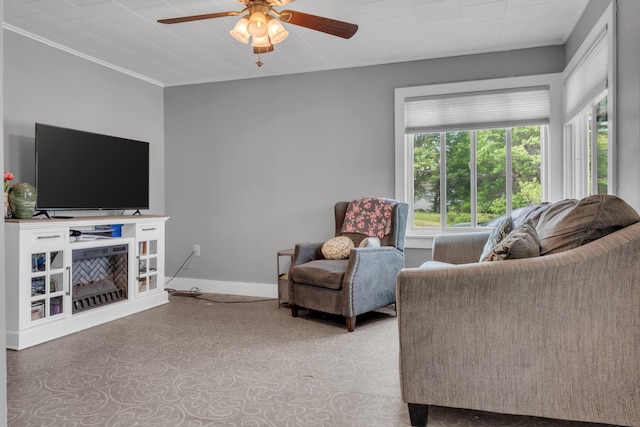 133 Middlesex Rd, Topsham, ME 04086 - living room featuring healthy amount of natural light, ceiling fan, baseboards, and crown molding