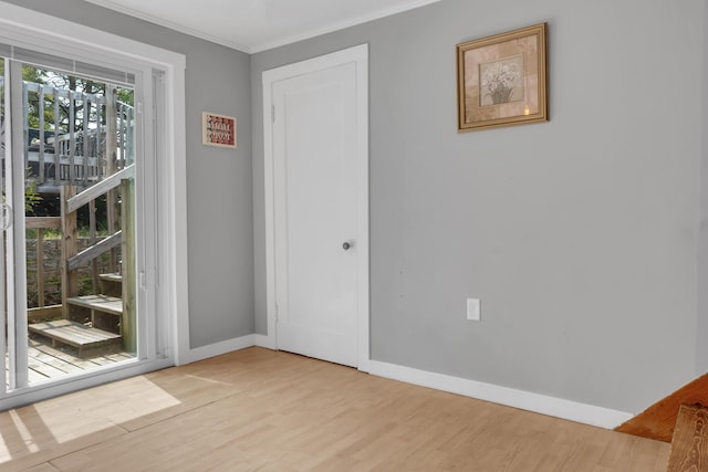 133 Middlesex Rd, Topsham, ME 04086 - spare room with wood finished floors, crown molding, and baseboards