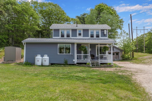 133 Middlesex Rd, Topsham, ME 04086 - view of front facade with a porch, a front lawn, a garage, and a shingled roof