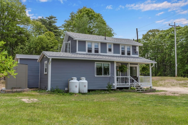 133 Middlesex Rd, Topsham, ME 04086 - view of front facade featuring a front lawn, roof with shingles, and covered porch