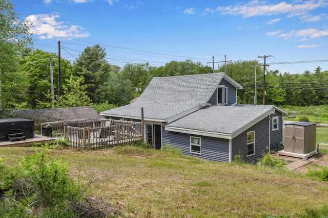 133 Middlesex Rd, Topsham, ME 04086 - rear view of house featuring a shingled roof, a lawn, and a wooden deck