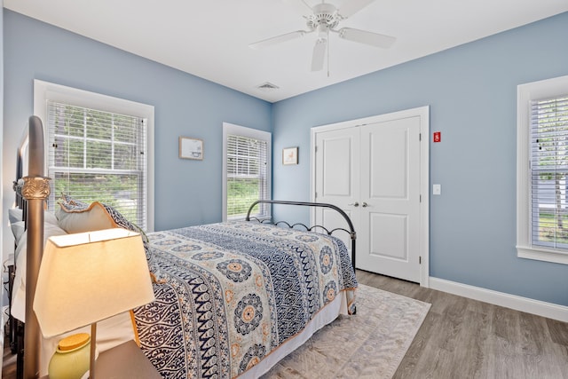 46 Patriot Way Unit 135, Arundel, ME 04046 - bedroom featuring wood finished floors, a closet, baseboards, and ceiling fan