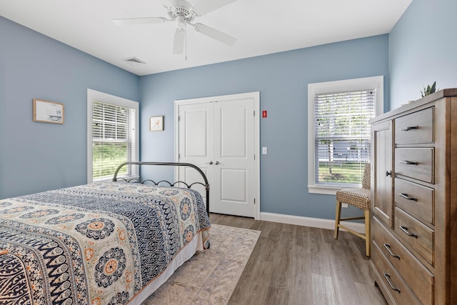46 Patriot Way Unit 135, Arundel, ME 04046 - bedroom featuring light wood-style floors, baseboards, a closet, and a ceiling fan