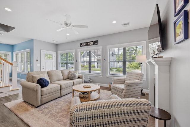46 Patriot Way Unit 135, Arundel, ME 04046 - living room with baseboards, wood finished floors, stairway, a ceiling fan, and recessed lighting