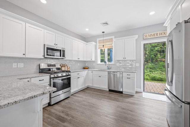 46 Patriot Way Unit 135, Arundel, ME 04046 - kitchen featuring appliances with stainless steel finishes, white cabinetry, light wood-type flooring, and recessed lighting