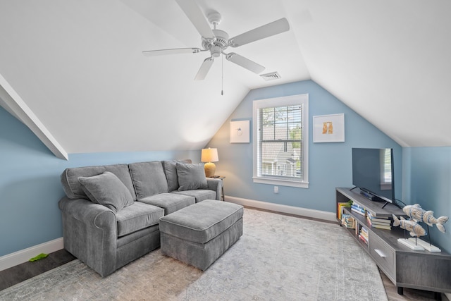 46 Patriot Way Unit 135, Arundel, ME 04046 - living room featuring vaulted ceiling, baseboards, ceiling fan, and wood finished floors