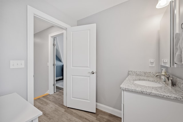 46 Patriot Way Unit 135, Arundel, ME 04046 - bathroom featuring vanity, wood finished floors, and baseboards