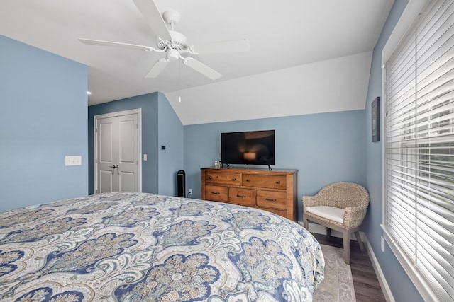 46 Patriot Way Unit 135, Arundel, ME 04046 - bedroom with wood finished floors, a ceiling fan, baseboards, and vaulted ceiling