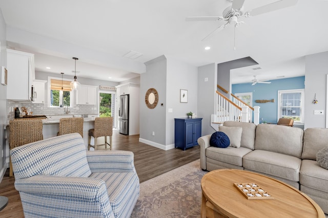 46 Patriot Way Unit 135, Arundel, ME 04046 - living area featuring ceiling fan, stairway, wood finished floors, baseboards, and recessed lighting