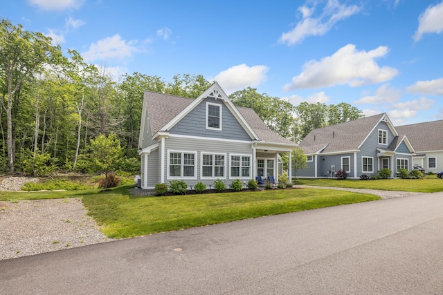 46 Patriot Way Unit 135, Arundel, ME 04046 - view of front of house featuring a front yard and a shingled roof