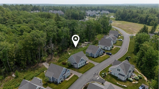 46 Patriot Way Unit 135, Arundel, ME 04046 - aerial view of property and surrounding area with a heavily wooded area and nearby suburban area