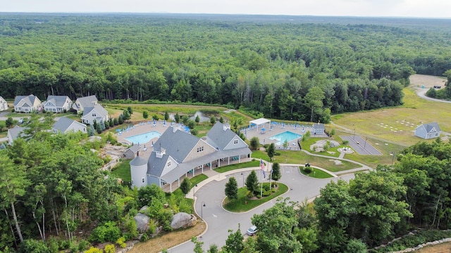 46 Patriot Way Unit 135, Arundel, ME 04046 - aerial overview of property's location with a heavily wooded area and a pool area
