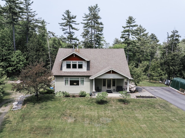15 Brookview Dr, Bucksport, ME 04416 - craftsman inspired home with a front lawn, a shingled roof, a porch, and driveway