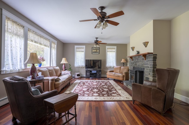 15 Brookview Dr, Bucksport, ME 04416 - living area with wood-type flooring, a ceiling fan, baseboards, vaulted ceiling, and a stone fireplace