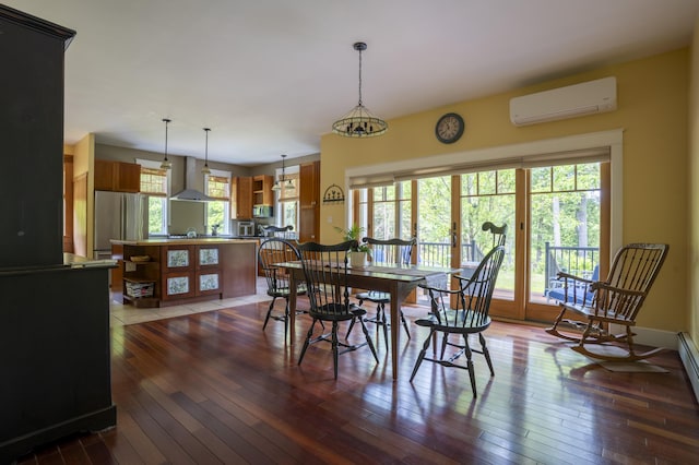 15 Brookview Dr, Bucksport, ME 04416 - dining room featuring a wall unit AC and hardwood / wood-style flooring