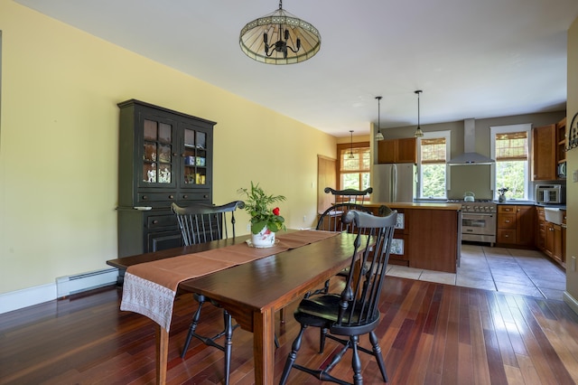 15 Brookview Dr, Bucksport, ME 04416 - dining space with hardwood / wood-style flooring, baseboard heating, a chandelier, and baseboards
