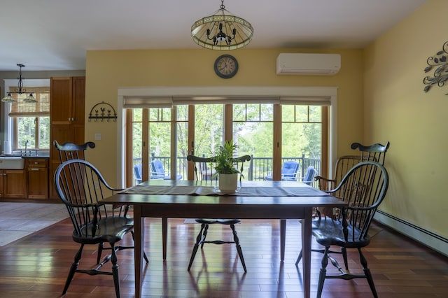 15 Brookview Dr, Bucksport, ME 04416 - dining space with a wall mounted air conditioner, healthy amount of natural light, baseboard heating, and light wood-style floors
